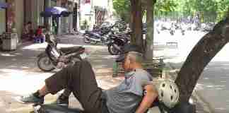 RoverTreks — Man sleeping on motorbike