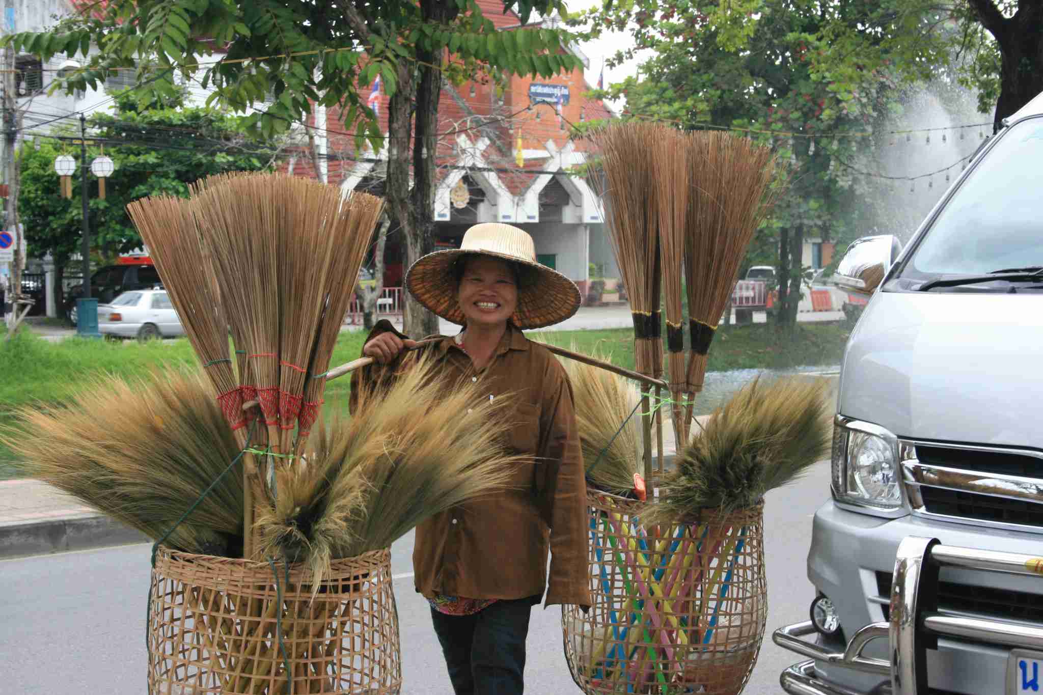 Lady selling brooms near the Smith Residence, Chiang Mai, Thailand